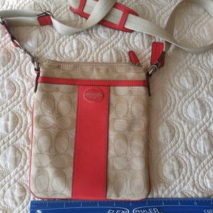 Coach beige canvas with pink leather crossbody bag. In like new condition.